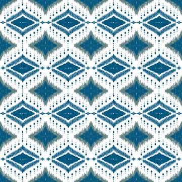 Blue and white ikat diamond seamless pattern, traditional ethnic geometric vector background.