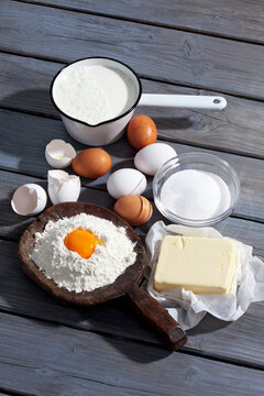 Baking ingredients on grey wooden table