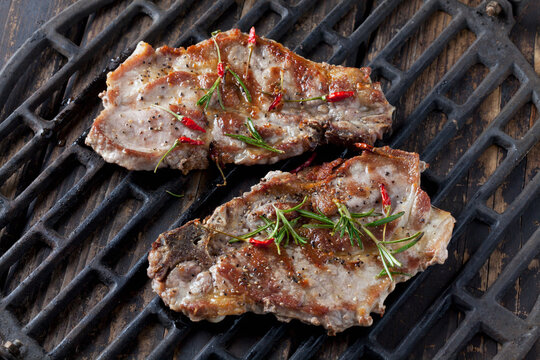 Pork collar cutlets on grill