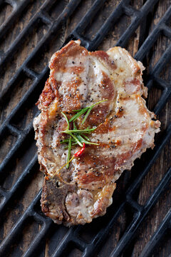Pork collar cutlet on grill