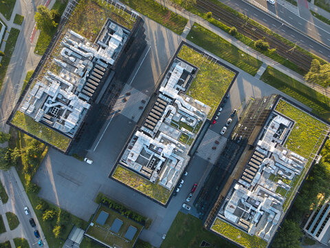 Aerial view of modern AI data center buildings with green roofs and complex ventilation systems situated in an urban area in Krakow, Lesser Poland Voivode, Poland.