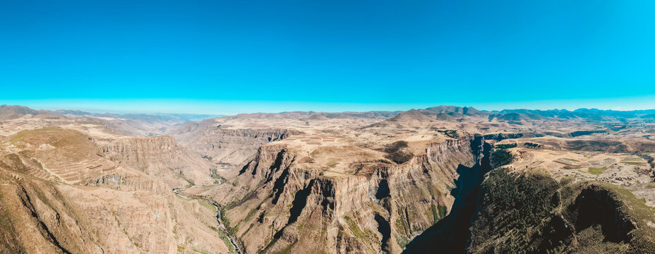 Ultra wide aerial panorama of a river canyon in the Lesotho highlands, Maluti Mountains, 13000 px drone panorama