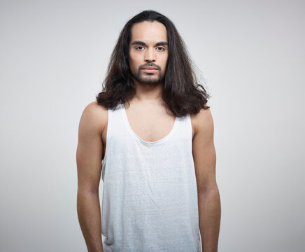 Portrait of young man against white background