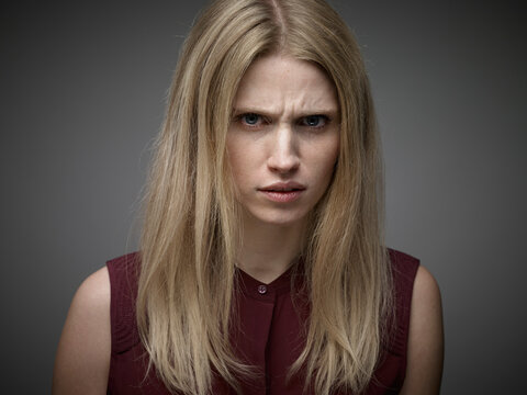 Portrait of sceptical looking youn woman
