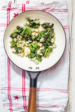 Pan with sauteed greens