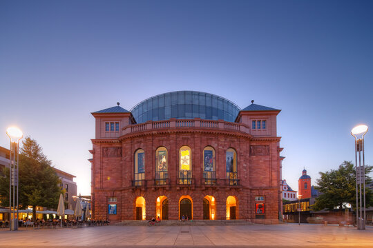 Germany, Mainz, view to lighted state theatre at Gutenberg Square