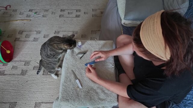 Middle-Aged Woman Doing Her Own Manicure With Nail File Today