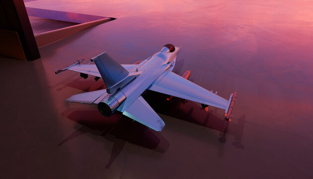 Top view of a modern fighter jet reflecting a sunset