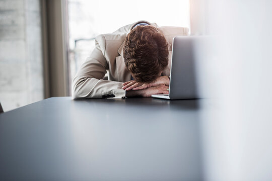 Exhausted businesswoman in office