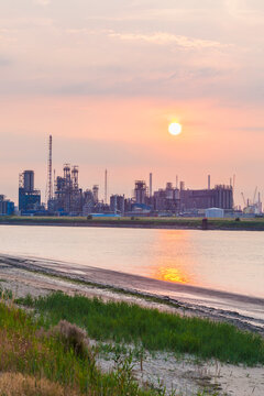 Belgium, Flanders, Antwerp, Scheidt river, industrial area, oil refinery at sunset