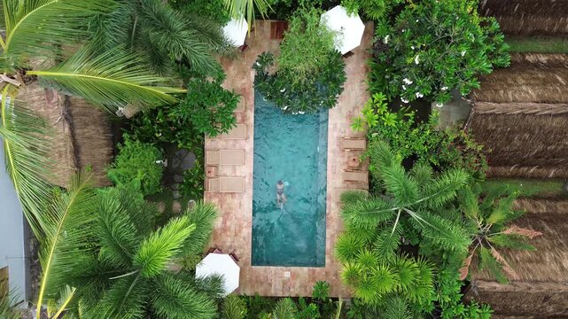 Drone footage capturing the enchanting riverside of hoi an ancient town in vietnam at twilight