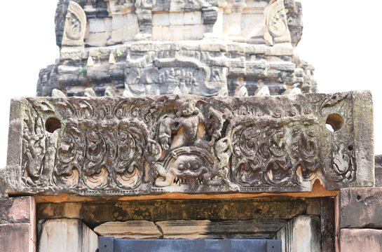 Detailed stone carving of deity riding Kala mask on the main entrance lintel at Phimai castle, Nakhon Ratchasima, Thailand