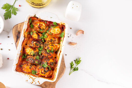 Viral Dump-and-Bake One Pan Dumpling Casserole. Tasty and simple Dumplings Bake Casserole recipe idea, made with frozen dumplings and tasty tomato sauce, fresh herbs and spices