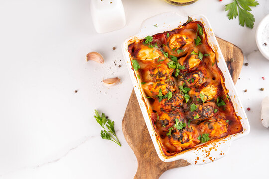 Viral Dump-and-Bake One Pan Dumpling Casserole. Tasty and simple Dumplings Bake Casserole recipe idea, made with frozen dumplings and tasty tomato sauce, fresh herbs and spices