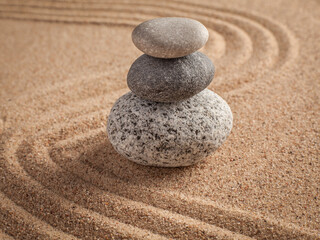 Obraz premium Japanese Zen stone garden - relaxation, meditation, simplicity alongside balance concept - pebbles and raked sand tranquil calm scene, with round stone