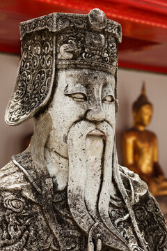 Wat Pho Chinese stone guardian face close-up view, Bangkok, Thailand