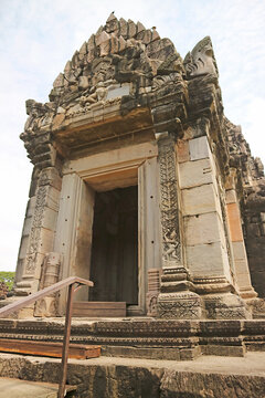 Ancient stone pediment featuring deity carvings above the main prang entrance at Phimai castle, Nakhon Ratchasima, Thailand