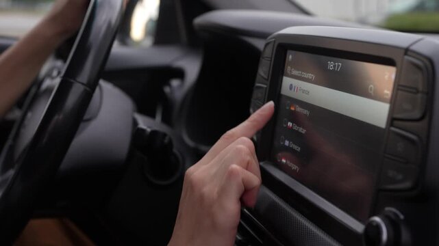 Close up of female hand using the navigation system