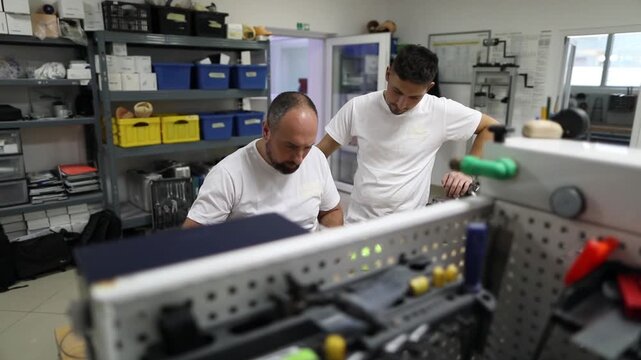 Orthopedic specialists assembling artificial limb together