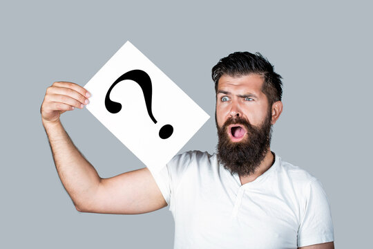 Scream man with question mark. Doubtful man asking questions to himself. Paper notes with question marks. Confused male thinking with question mark