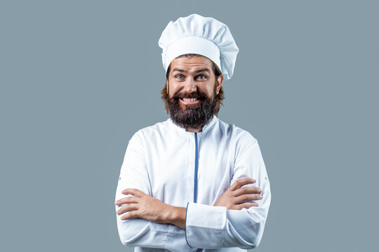 Portrait of a happy chef cook. Cook hat. Bearded chef, cooks or baker. Bearded male chefs isolated on gray. Funny chef with beard cook. Beard man and moustache wearing bib apron