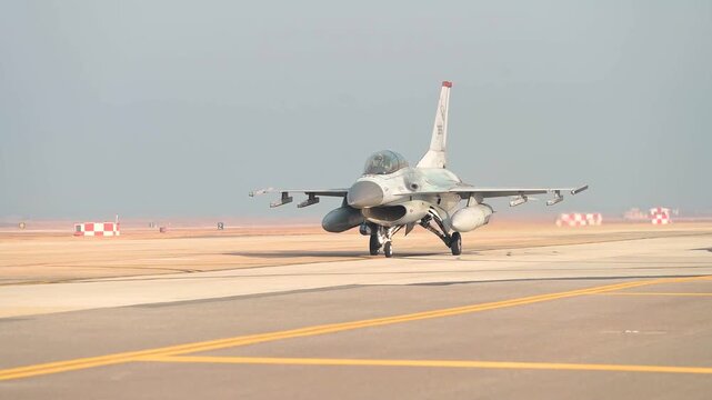U.S. Air Force F-16 Fighting Falcon taxis along the runway before a combat training sortie mission.