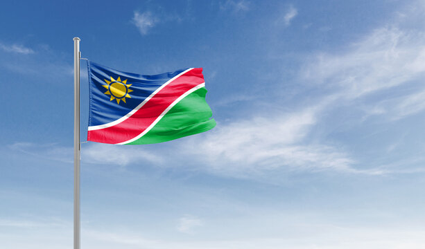Namibia national flag waving in the sky.