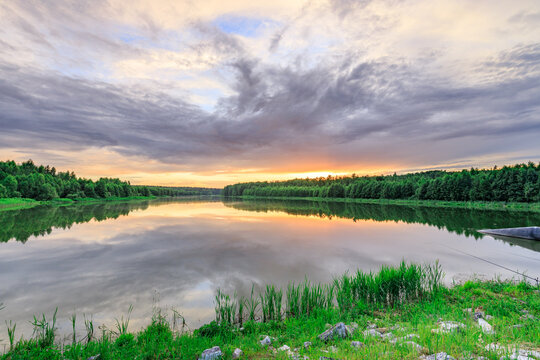 Soft golden light kisses calm lake surface