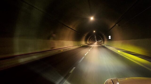 Swat Motorway Tunnel 1 with bright overhead lights and clear road markings along the M‑16 route in Malakand, Khyber Pakhtunkhwa.