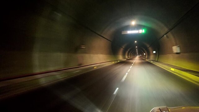 Swat Motorway Tunnel 1 with bright overhead lights and clear road markings along the M‑16 route in Malakand, Khyber Pakhtunkhwa.