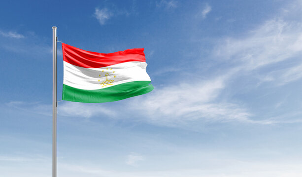 Tajikistan national flag waving in the sky.