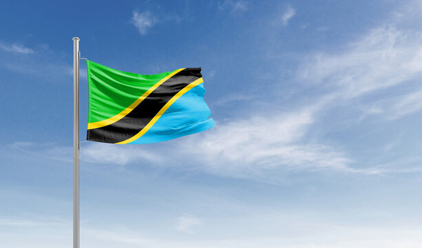 Tanzania national flag waving in the sky.