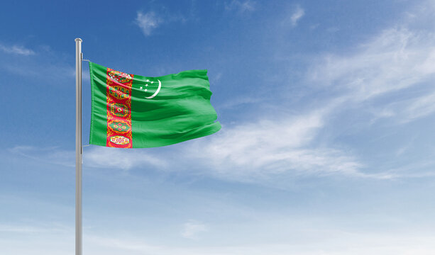 Turkmenistan national flag waving in the sky.