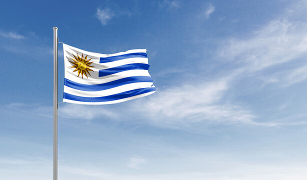 Uruguay national flag waving in the sky.