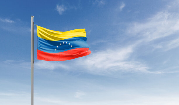 Venezuela national flag waving in the sky.