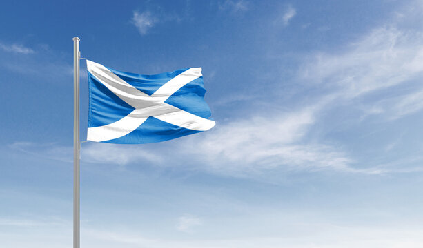 Scotland national flag waving in the sky.