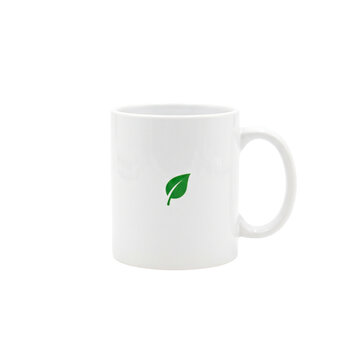 White ceramic mug with a simple green leaf logo design for eco friendly branding and products PNG Isolated on transparent background