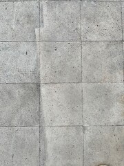Fototapeta premium Grungy weathered grey concrete floor tiles texture background with rough stained stone surface pattern and grout lines