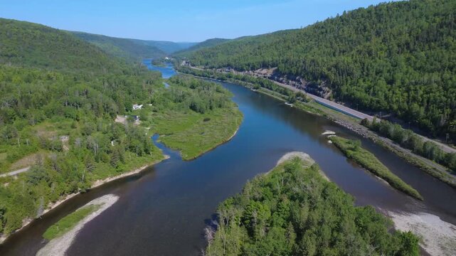 High-resolution drone footage captures Route 132, dense forests and the iconic Matapedia River flowing through the Appalachian Mountains.