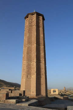 Historic Ghazni Minaret in Ghazni, Afghanistan, a remarkable 12th-century monument featuring intricate brickwork and Islamic architectural design.
