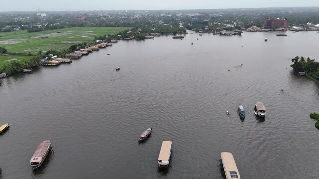 High-altitude aerial footage captures the finishing point island on Punnamada Lake in Alappuzha, Kerala, famous as the landmark venue for the annual Nehru Trophy Snake Boat Race.