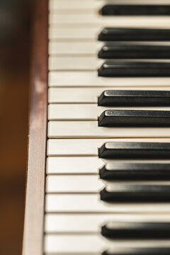 Soft focused upright piano keyboard showing classic musical detail.