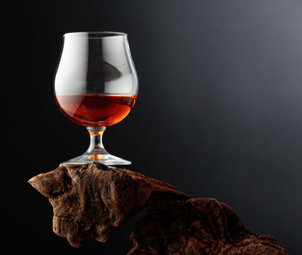 Whiskey on weathered driftwood.