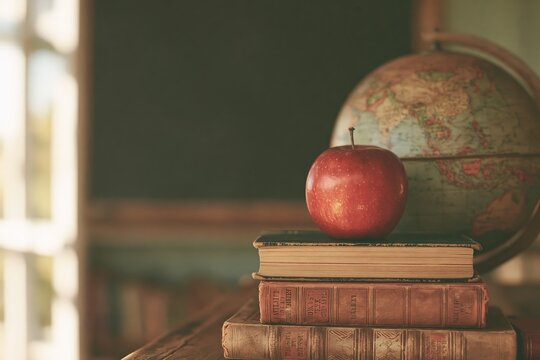 Vintage classroom scene with apple on books and globe, symbolizing education