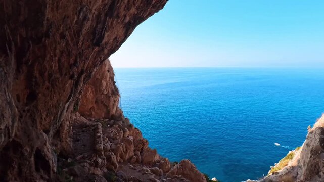 Dramatic Coastal Landscape Revealed Through a Natural Rock Passage, Noli, Italy - PANORAMIC VIDEO