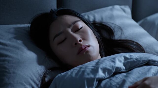 Serene Woman Sleeping Peacefully in Cozy Bed at Night 4K