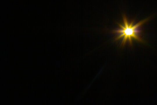 Sun flare on the black background
