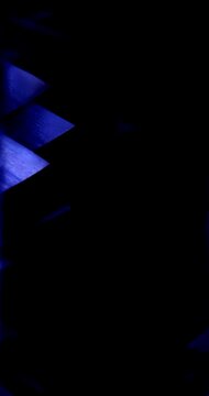 Dark Geometric Pattern with Blue Light. Abstract black structure with glowing blue highlights in darkness.