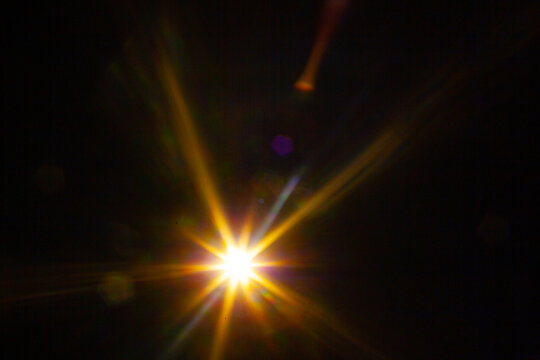 Sun flare on the black background