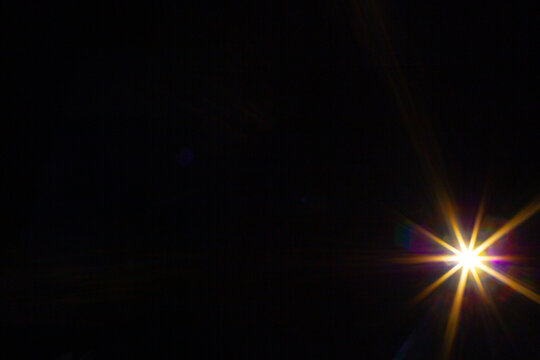 Sun flare on the black background